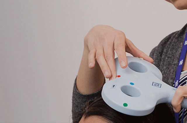 One of our researchers on our TMS machine