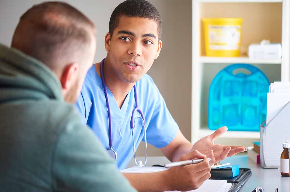 man has consultation with doctor