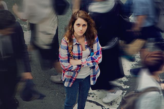 A women surrounded by other people